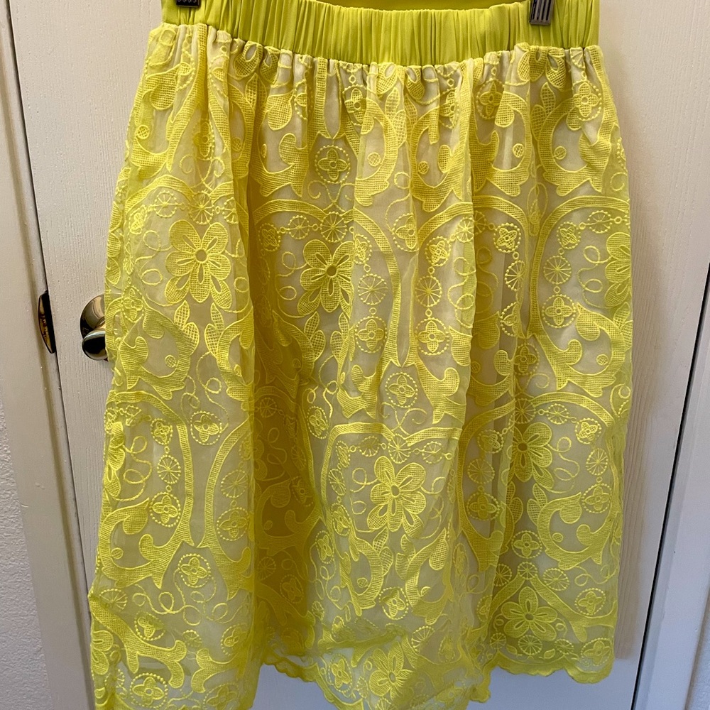 Bright yellow a-line midi skirt.